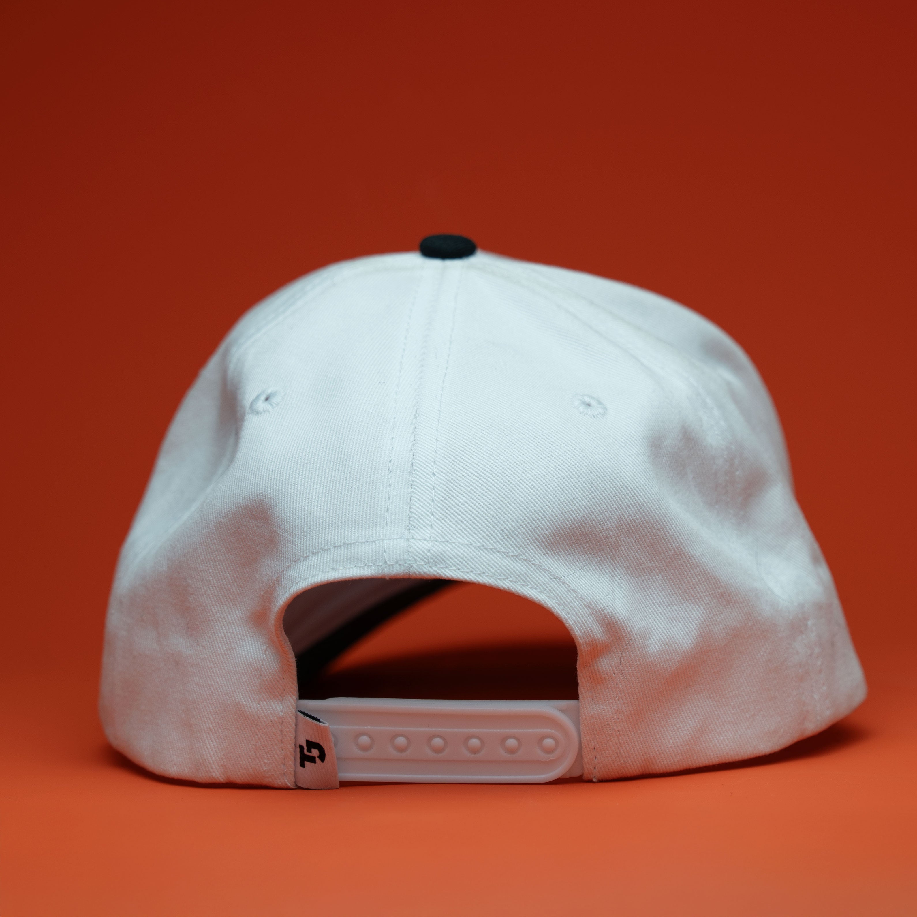 White cap on an red background