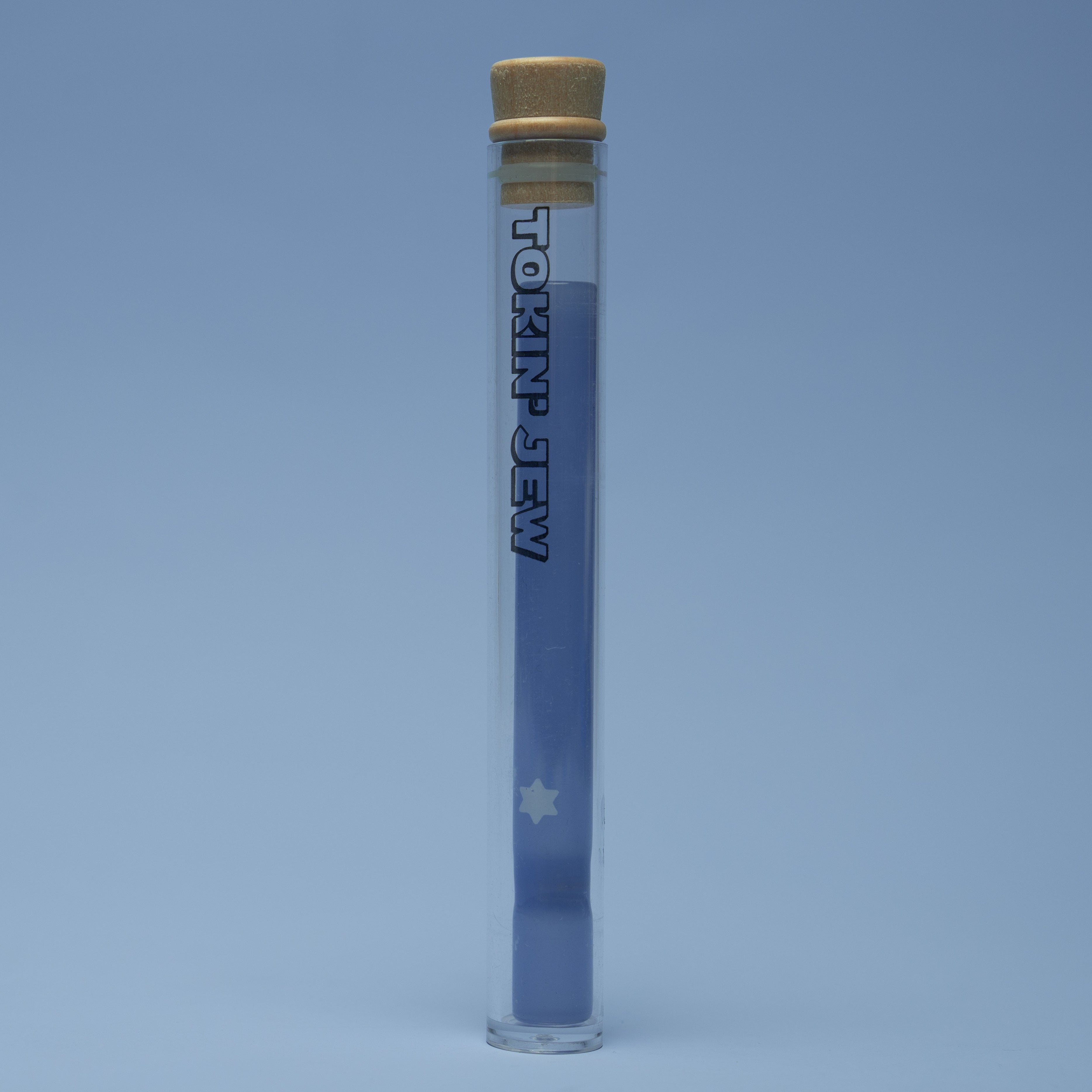 Clear tube with a tan cap and blue one hitter on a light blue background