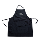 Black apron with 'Baked but not leavened' text on a white background