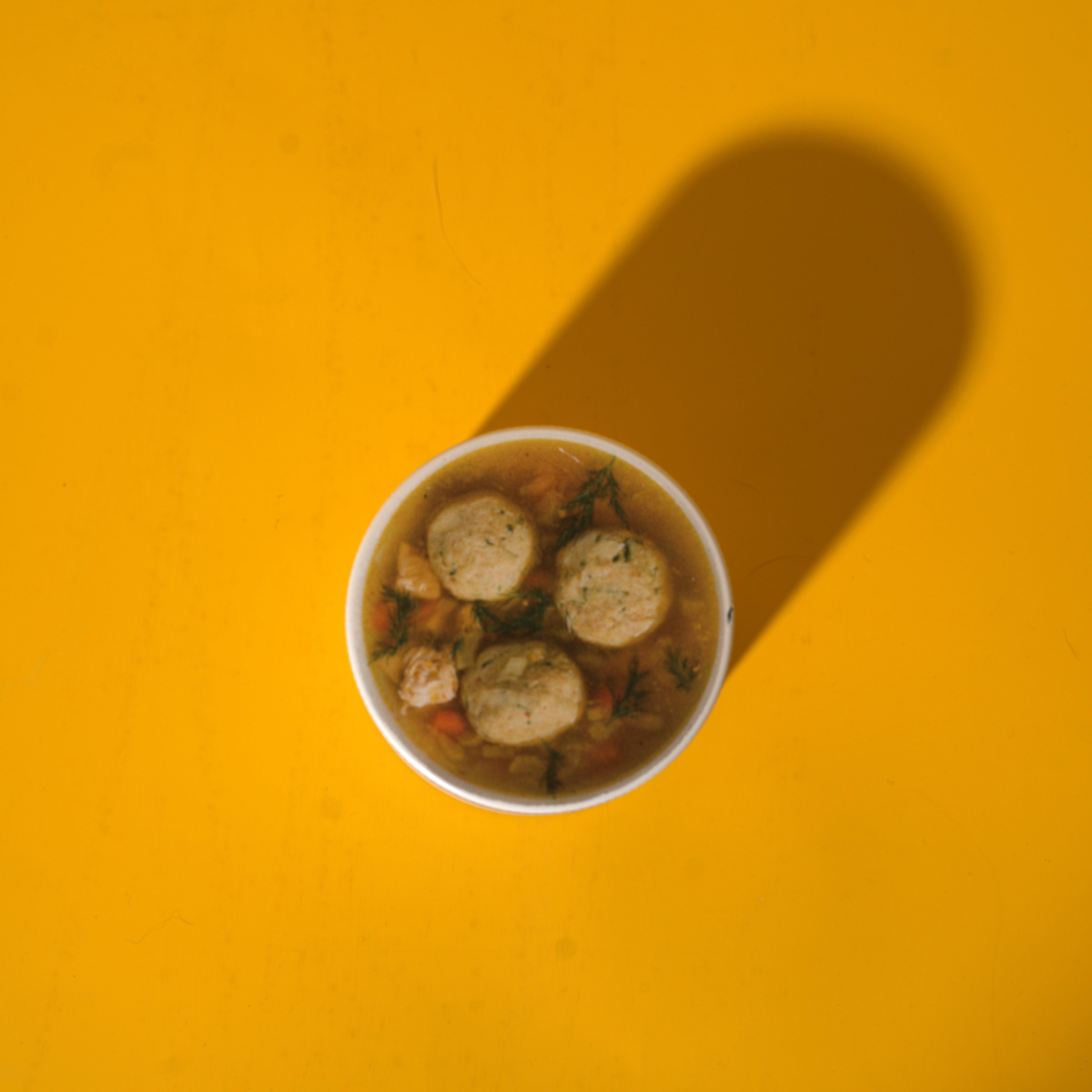 Tokin' Jew matzo Ball Soup Grinder on a yellow background with shadow